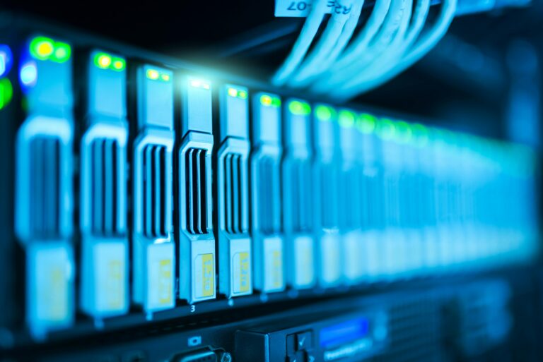 Close-up of server rack with glowing indicators.